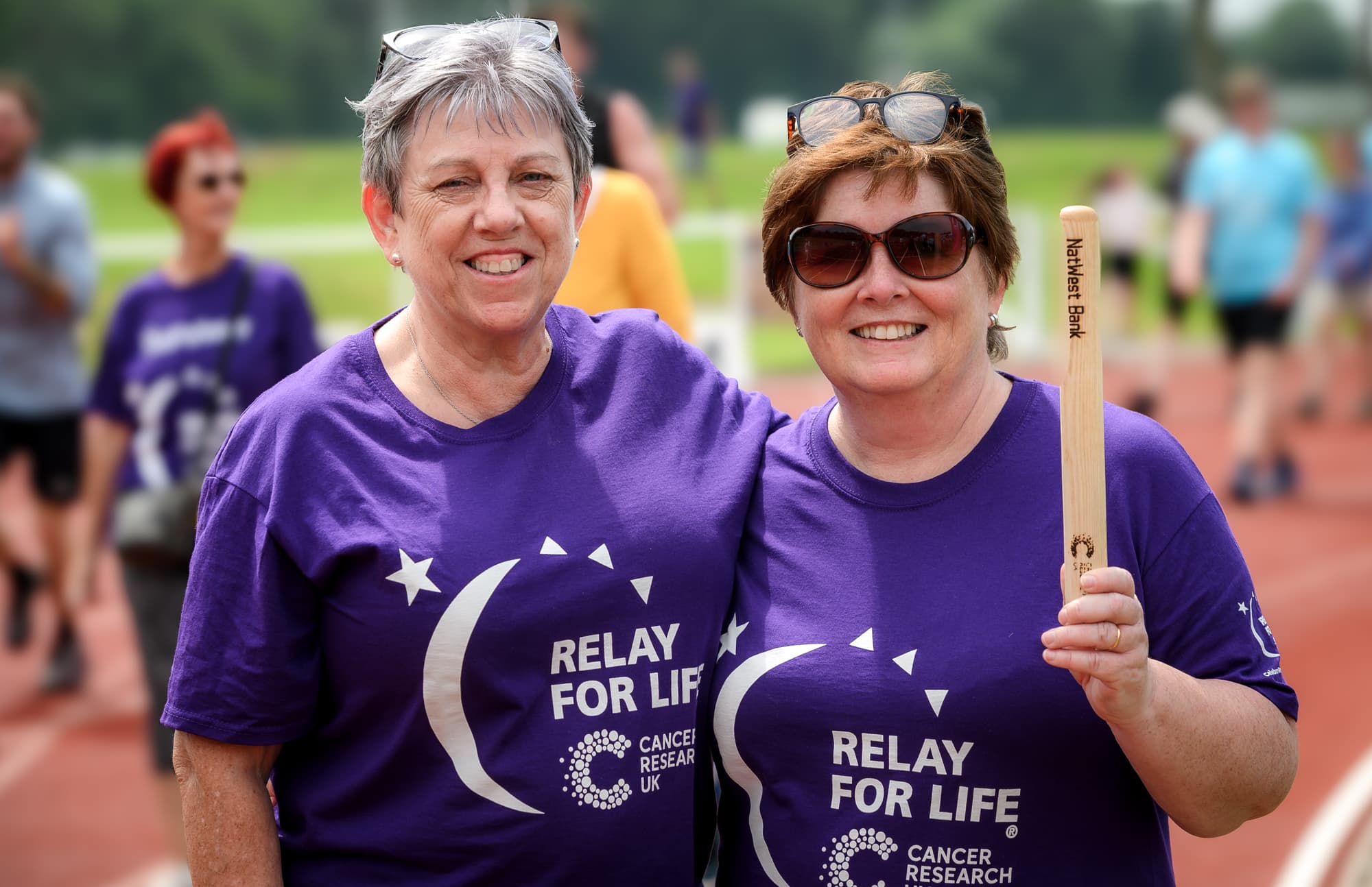 Sign up Survivor, two people celebrating at Relay For Life.