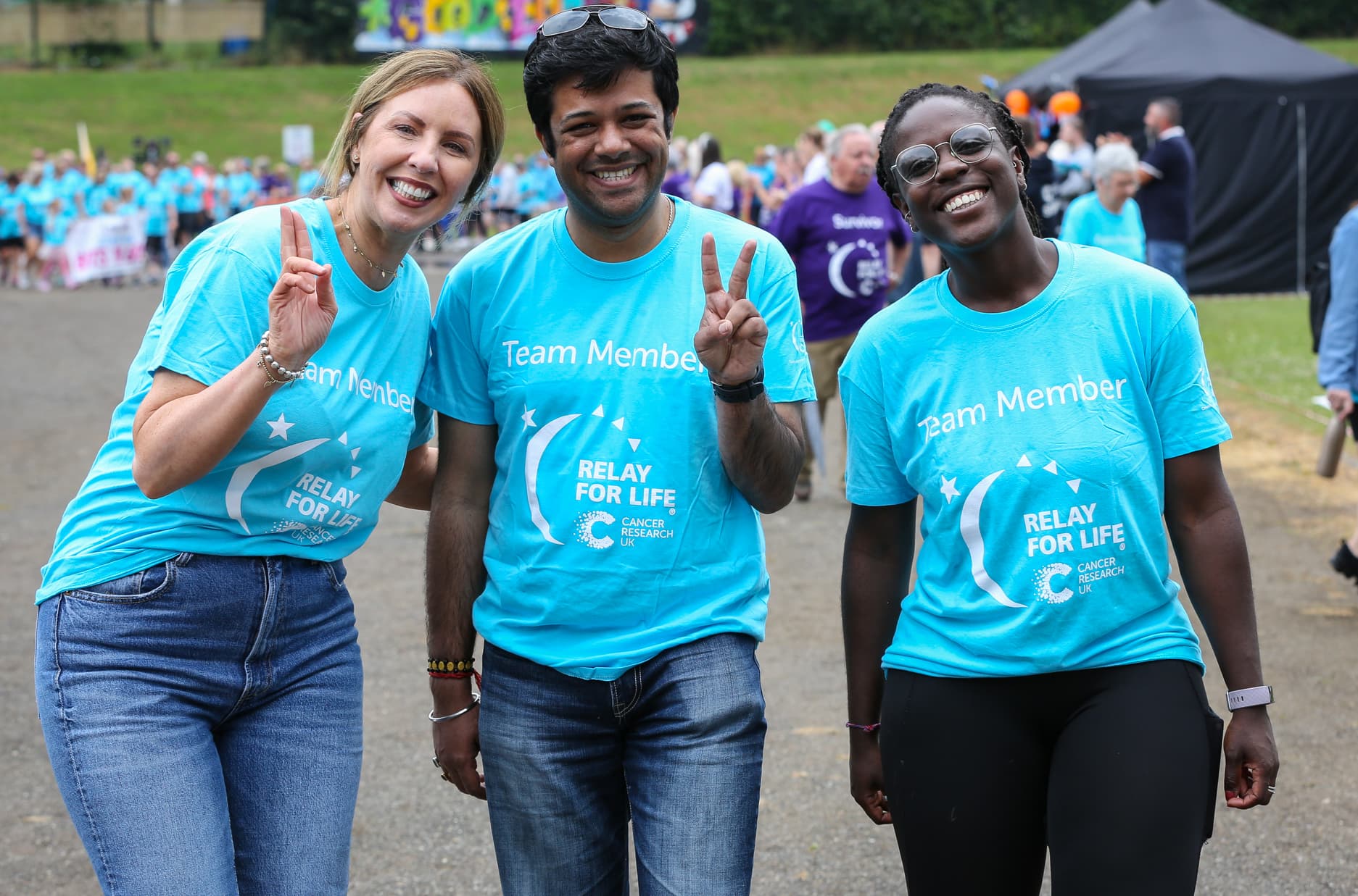 Join a team, a lady and her baby at Relay For Life - Photographer Brian Thompson.