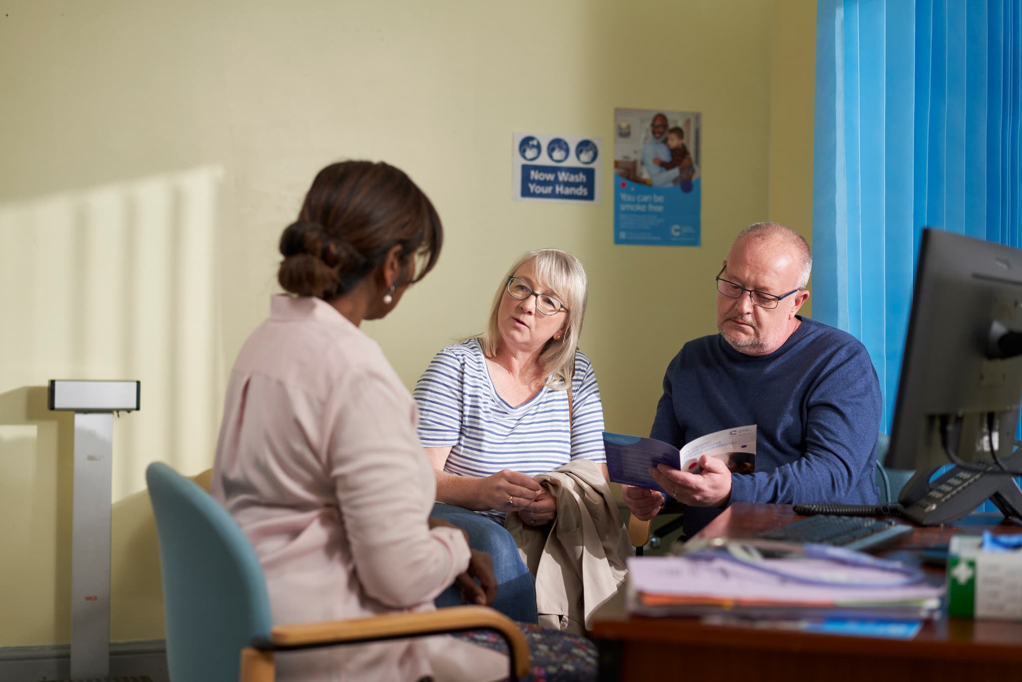Image of a couple talking with a health professional.
