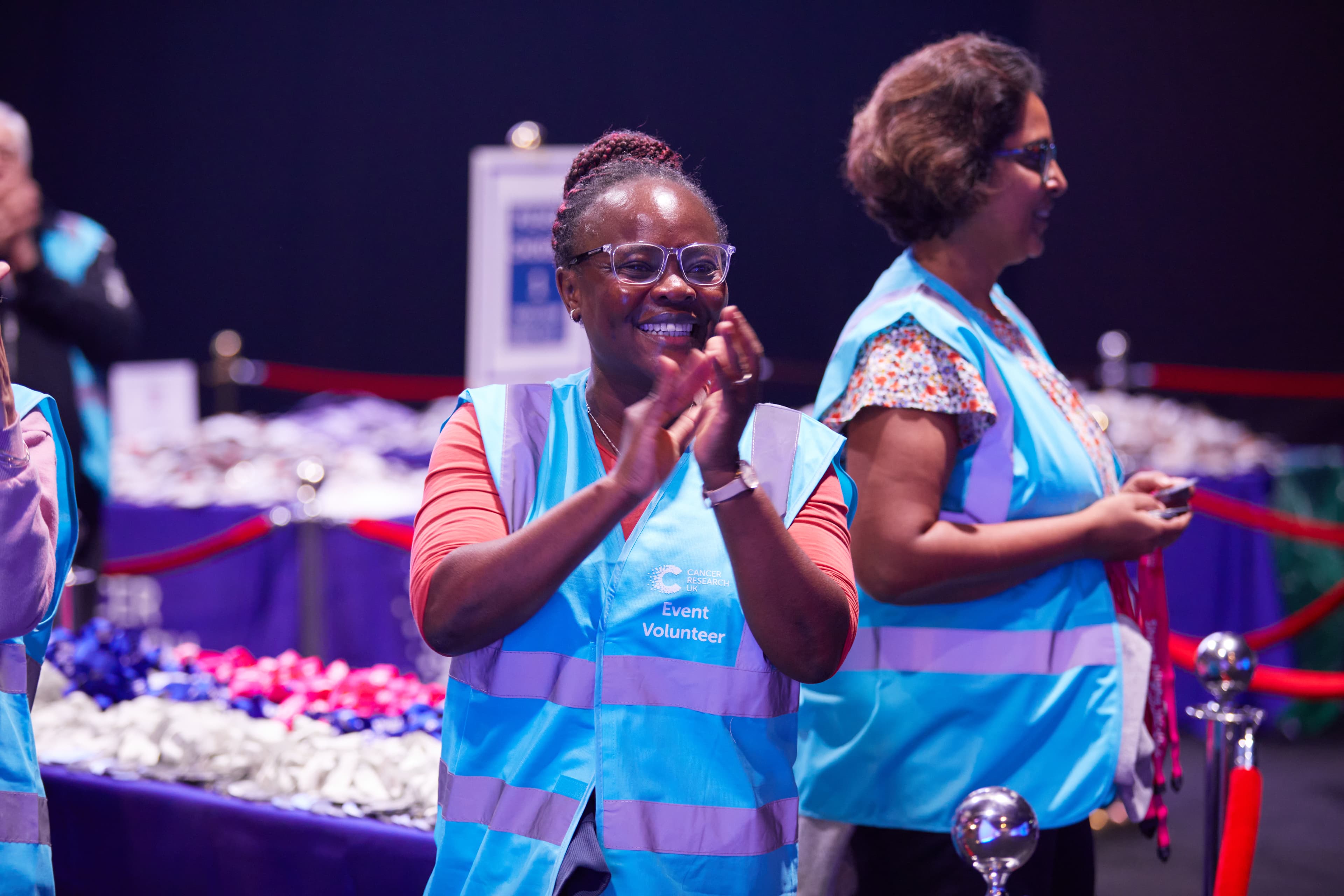Shine event volunteer cheering. CRUK Shine event London 2023.
