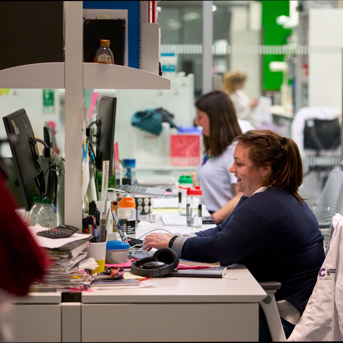 A researcher sat at a desk in front of a computer.