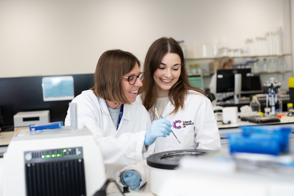 Two female researchers working in a lab.