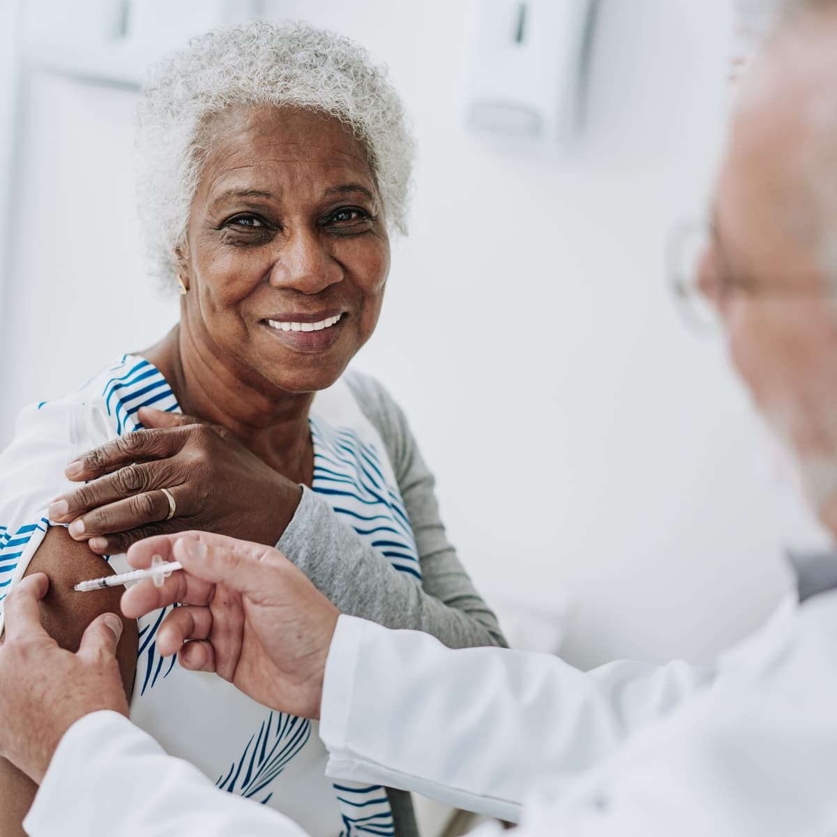 Stock image of a woman getting a vaccine.