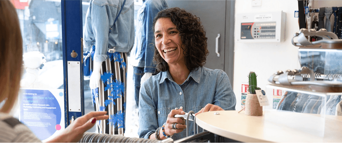 A photo of a volunteer at a Cancer Research UK.