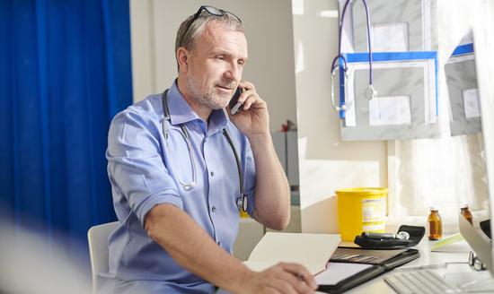 An image of a doctor on the phone