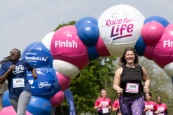 Two women crossing the finish line at Race for Life