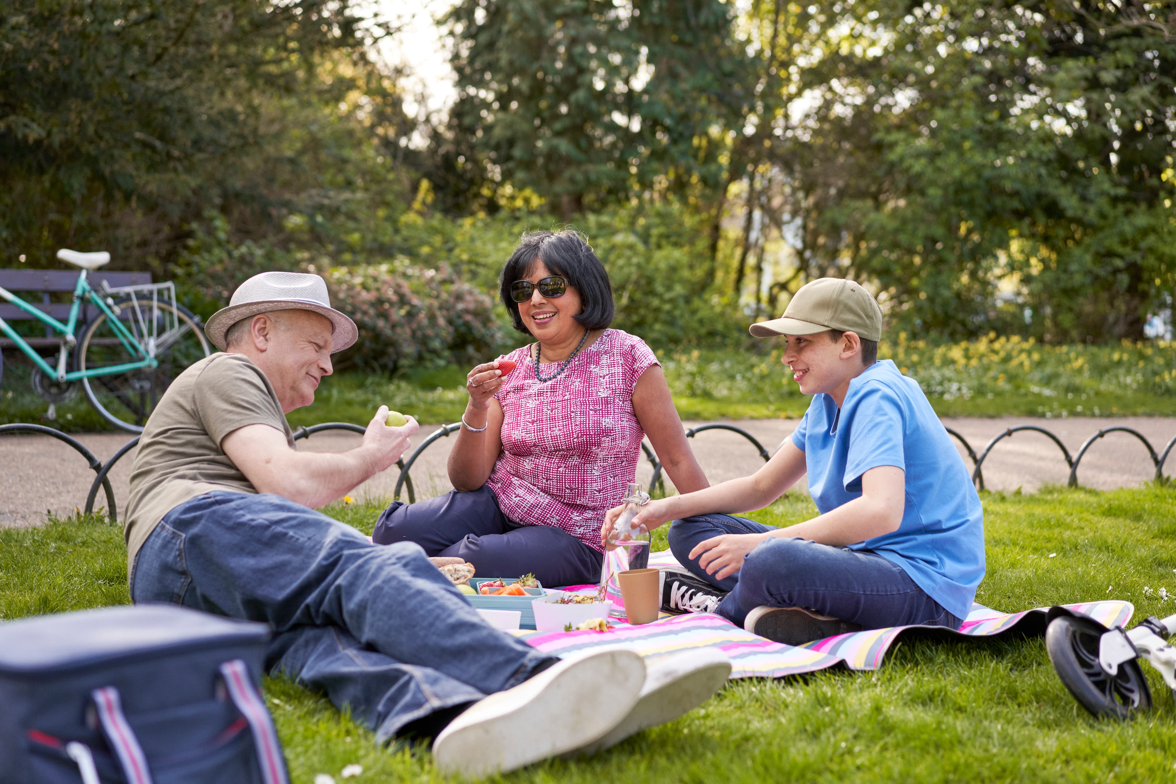 A photo of a family having a picnic.